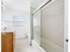 Bathroom features a vanity with drawers, tiled floors, and a shower/tub combination at 1431 Kings Hwy, Clearwater, FL 33755