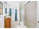 Updated bathroom with modern vanity, tile flooring, shower and bathtub combination at 1431 Kings Hwy, Clearwater, FL 33755