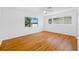 Inviting bedroom with hardwood floors, large windows, and ample natural light at 1431 Kings Hwy, Clearwater, FL 33755
