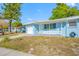 Charming house with a freshly painted exterior, garage, and well-kept lawn at 1431 Kings Hwy, Clearwater, FL 33755