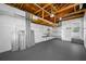 Spacious garage with exposed wood beams, painted walls, and ample storage space at 1431 Kings Hwy, Clearwater, FL 33755