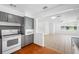 Open-concept kitchen view to living area with lots of natural light and ceiling fan at 1431 Kings Hwy, Clearwater, FL 33755