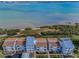 Coastal townhouses with pristine waterfront views showcase the community's picturesque setting and serene lifestyle at 1451 Gulf Blvd # 207, Clearwater Beach, FL 33767
