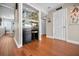 Charming bar area featuring mirrored shelving, granite countertop and wood flooring at 1451 Gulf Blvd # 207, Clearwater Beach, FL 33767