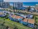 An aerial shot of charming condominiums featuring private balconies and well-maintained lawns at 1451 Gulf Blvd # 207, Clearwater Beach, FL 33767