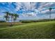 Expansive green space with manicured lawn and lush vegetation overlooking the water at 1451 Gulf Blvd # 207, Clearwater Beach, FL 33767