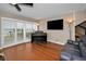 Bright living room featuring a piano and sliding doors that open to the water view at 1451 Gulf Blvd # 207, Clearwater Beach, FL 33767