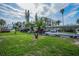Outdoor parking area with covered parking spots and view of nearby condos at 1451 Gulf Blvd # 207, Clearwater Beach, FL 33767
