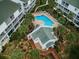 Aerial view showcasing the community pool, clubhouse, and surrounding lush landscaping and residences at 14692 Seminole Trl, Seminole, FL 33776