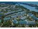 Wide aerial view showcasing a condo community along a waterway near the ocean at 14692 Seminole Trl, Seminole, FL 33776