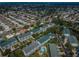 Bird's eye view displays residential neighborhood with condominiums, tree-lined streets, and community pool at 14692 Seminole Trl, Seminole, FL 33776