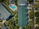 Overhead shot of a building with a pool and trees nearby at 14692 Seminole Trl, Seminole, FL 33776