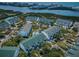 Aerial view of a waterfront condo complex with a pool and manicured landscaping by the bay at 14692 Seminole Trl, Seminole, FL 33776