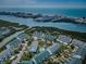 Scenic aerial view of waterfront community featuring townhomes, lush landscaping, and boat access at 14692 Seminole Trl, Seminole, FL 33776