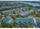Aerial view of a townhome community with beautiful waterfront views and lush surroundings at 14692 Seminole Trl, Seminole, FL 33776