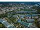 Aerial view showcases a large neighborhood featuring a condo community near a body of water at 14692 Seminole Trl, Seminole, FL 33776