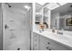 This bathroom features a shower, vanity, and built-in shelving at 14692 Seminole Trl, Seminole, FL 33776