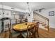 Open dining area leading to kitchen, bar, and staircase at 14692 Seminole Trl, Seminole, FL 33776