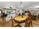 Open-concept dining area with views to the living room and outdoor balcony at 14692 Seminole Trl, Seminole, FL 33776