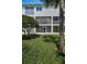 White condo building with screen patios outside at 14692 Seminole Trl, Seminole, FL 33776