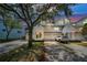 Charming townhome exterior featuring white siding, attached garage, and well-maintained landscaping at 14692 Seminole Trl, Seminole, FL 33776