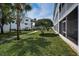 White condo building with a grassy lawn in front at 14692 Seminole Trl, Seminole, FL 33776