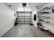 Spacious one car garage with carpet floor, storage shelves and garage door with opener at 14692 Seminole Trl, Seminole, FL 33776