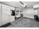 This garage has a gray carpet, storage, a bicycle, and a door to the house at 14692 Seminole Trl, Seminole, FL 33776