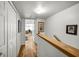 Hallway with wooden floors, closet, and access to rooms at 14692 Seminole Trl, Seminole, FL 33776