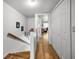 Hallway with wooden floors, closet, and access to rooms at 14692 Seminole Trl, Seminole, FL 33776