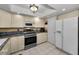 Well-equipped kitchen with stainless steel appliances and bright lighting at 14692 Seminole Trl, Seminole, FL 33776