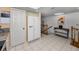 Bright eat-in kitchen with white cabinets and stainless steel refrigerator at 14692 Seminole Trl, Seminole, FL 33776