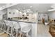 Bright kitchen with white cabinets and barstool seating area at 14692 Seminole Trl, Seminole, FL 33776