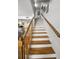 Traditional staircase with wooden railing and white risers at 14692 Seminole Trl, Seminole, FL 33776