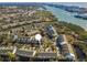 Gorgeous aerial view of townhouse complex situated on the waterfront with stunning bay views and lush landscaping at 14723 Seminole Trl, Seminole, FL 33776