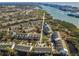 Serene aerial view of a waterfront townhouse community with lush surroundings and picturesque bay access at 14723 Seminole Trl, Seminole, FL 33776