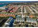 Beautiful aerial view of townhomes with mature trees in a waterfront neighborhood with community tennis court at 14723 Seminole Trl, Seminole, FL 33776