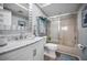 This bathroom features a tub with shower, stylish vanity, and plenty of light at 14723 Seminole Trl, Seminole, FL 33776