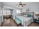 Comfortable bedroom with a fan and stylish furnishings, creating a relaxing retreat at 14723 Seminole Trl, Seminole, FL 33776