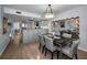 Open concept dining room with modern table set and view of the kitchen, offering space for entertaining at 14723 Seminole Trl, Seminole, FL 33776