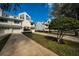 Pleasant townhouse exteriors with attached garages, healthy landscaping, and well-maintained driveways at 14723 Seminole Trl, Seminole, FL 33776