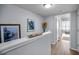 Bright hallway features artwork and decor, leading to a comfortable sitting area at 14723 Seminole Trl, Seminole, FL 33776