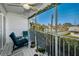 Spacious screened lanai with cozy seating and pleasant neighborhood views, perfect for enjoying the outdoors at 14723 Seminole Trl, Seminole, FL 33776