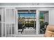 Screened lanai features sliding glass doors and view of outdoor seating area, creating an outdoor living space at 14723 Seminole Trl, Seminole, FL 33776