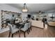 Open-concept living area with a dining table and sliding glass doors to the outside at 14723 Seminole Trl, Seminole, FL 33776