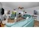Bright living room with comfortable seating, ceiling fan, and sliding doors to the outside at 14723 Seminole Trl, Seminole, FL 33776