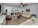 Inviting living room with sliding glass doors, plantation shutters, and comfortable seating at 14723 Seminole Trl, Seminole, FL 33776