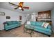Bright living room with comfortable seating, ceiling fan, and decorative accents at 14723 Seminole Trl, Seminole, FL 33776