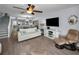 Open-concept living room flowing into the dining area and kitchen with a staircase at 14723 Seminole Trl, Seminole, FL 33776