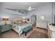Primary bedroom showcases vaulted ceilings, natural lighting, and tastefully decorated furniture at 14723 Seminole Trl, Seminole, FL 33776
